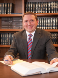 man sitting in law library